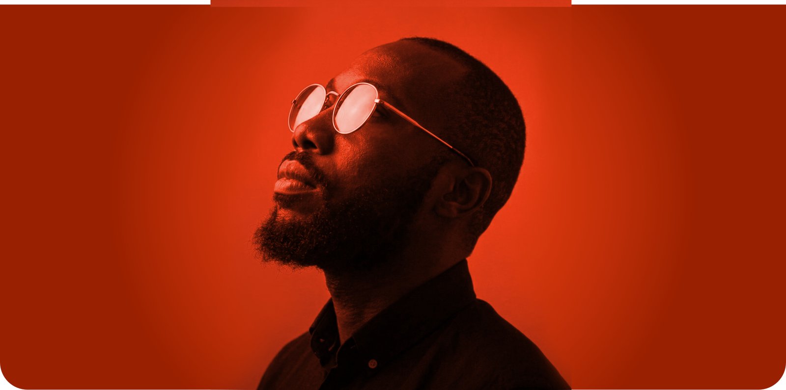 Portrait of Ernest Adzesu in orange red light